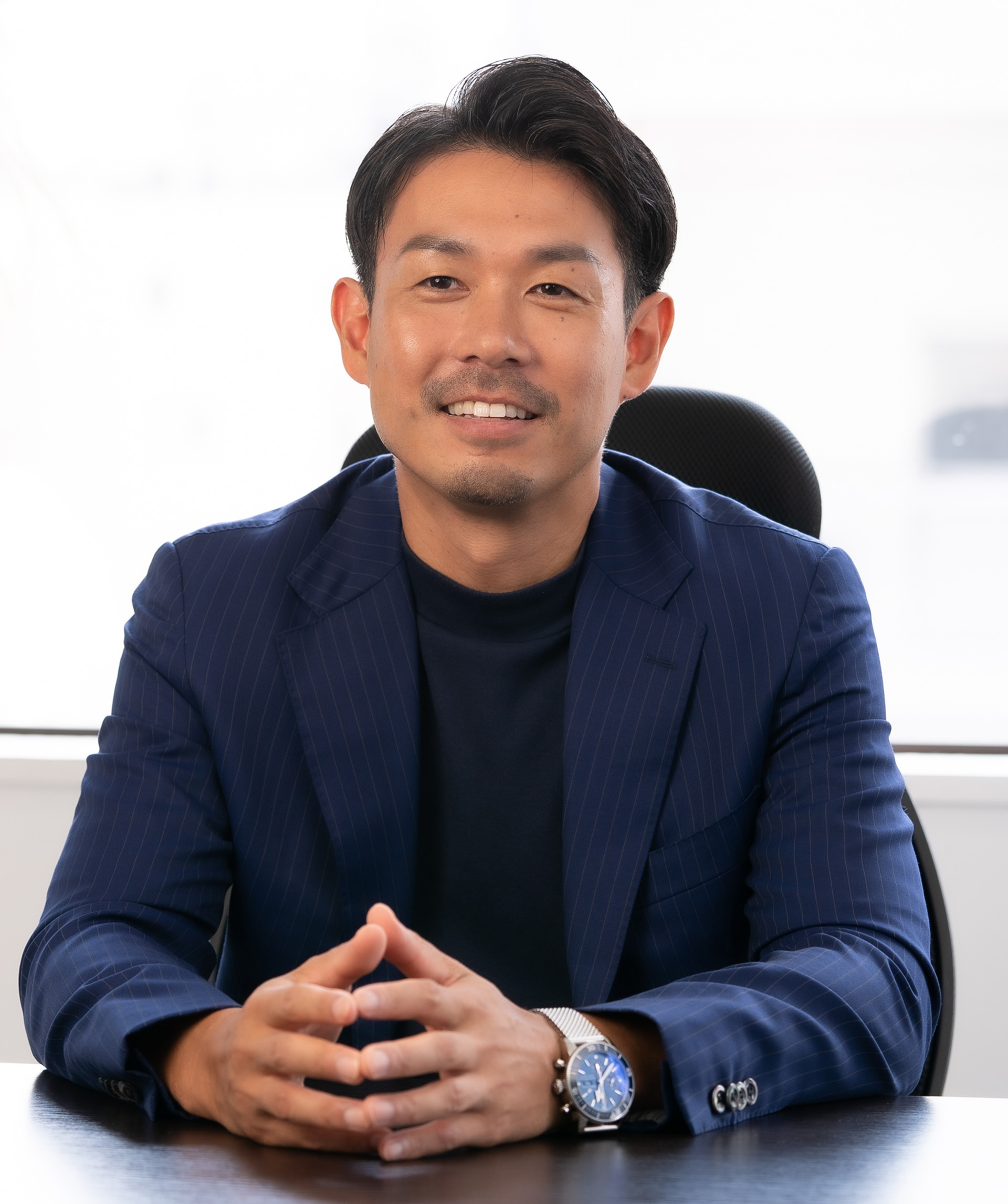 東信化学工業株式会社 専務取締役 久野智孝